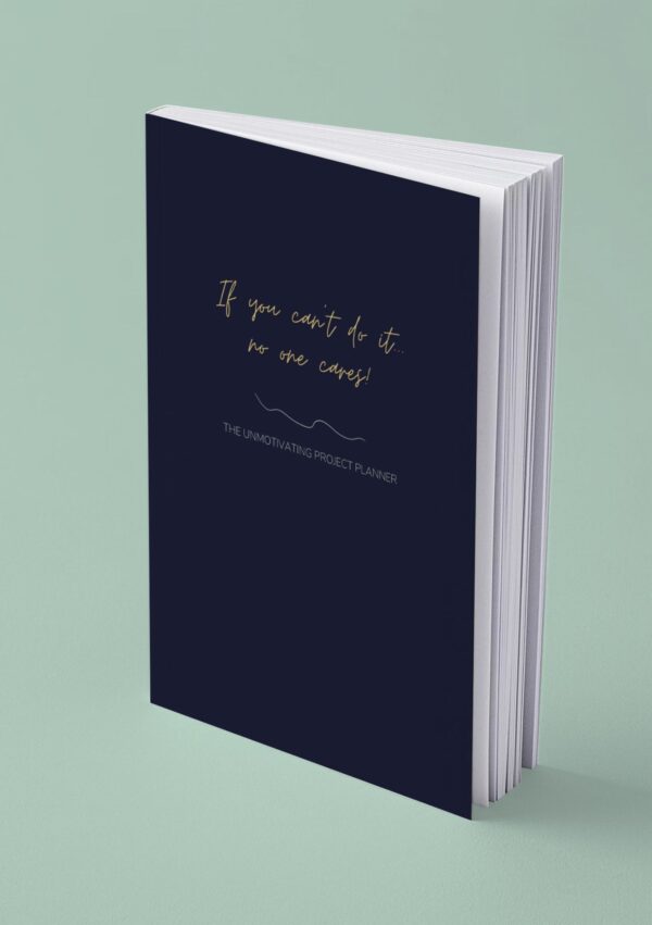 Mock up image of paperback funny unmotivating project planner. Dark blue matte cover "If you can't do it, no one cares."