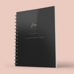Coil Bound black cover Mock up image of The Uninspirational Notebook, black.